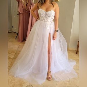 Custom made, bodysuit style with high slit and sheer dress.